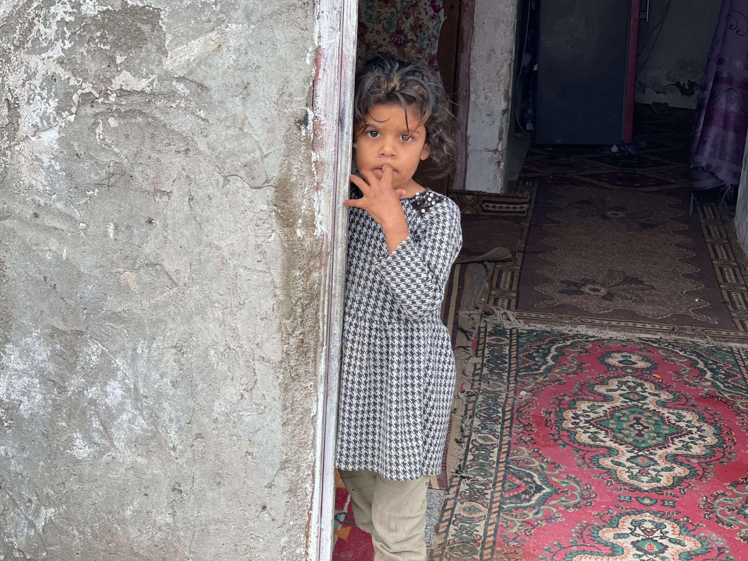 Child receiving back to school support from Imam Hussein Charity
