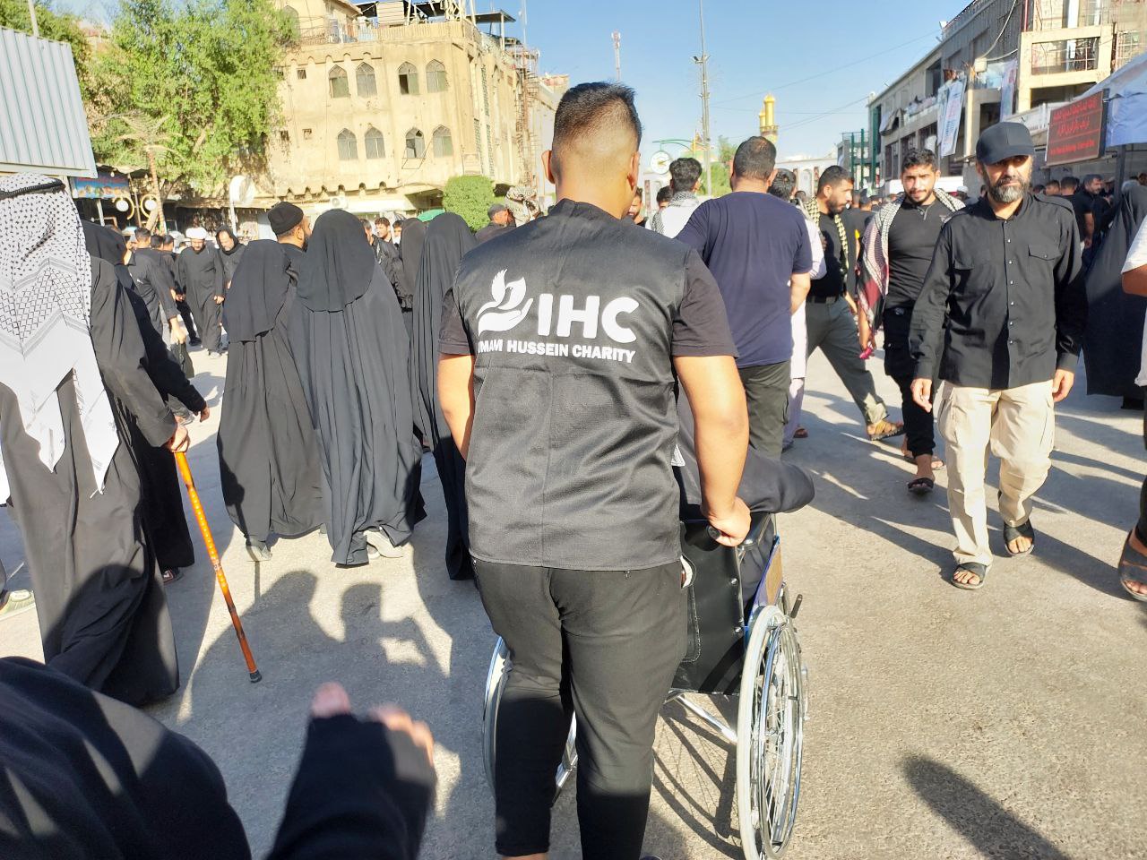 Volunteers serving pilgrims at the Imam Hussein Charity mawkib